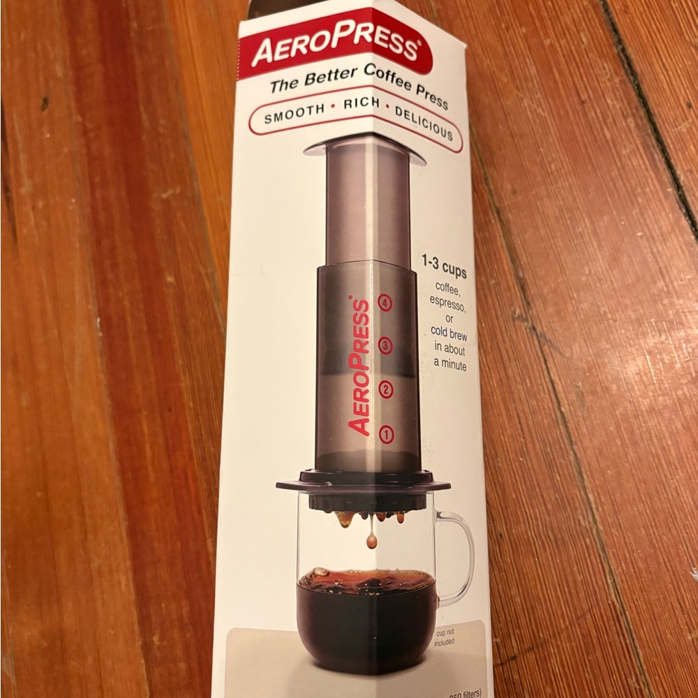 AeroPress coffee maker in box with all parts and filters